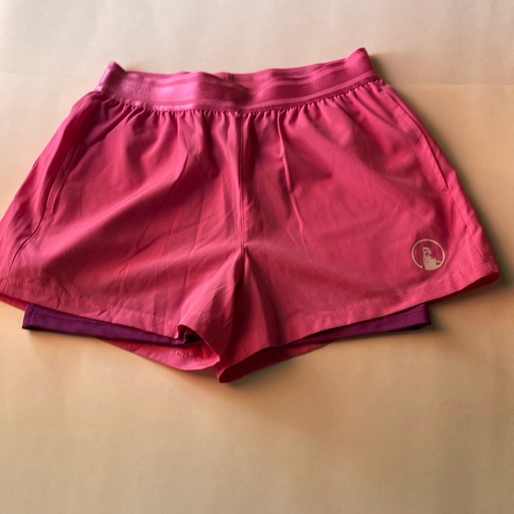 Cute pink shorts brand new. Has purple undershorts and two side pockets. SM
